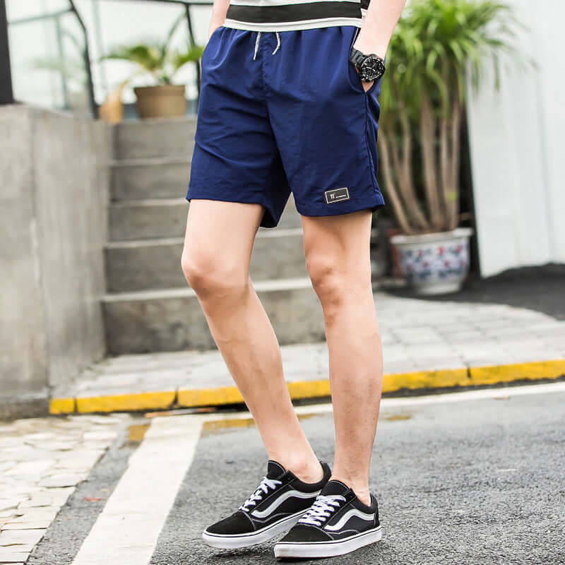 2020 summer men's shorts Korean version of the trend summer sports loose five points casual speed trousers Taobao