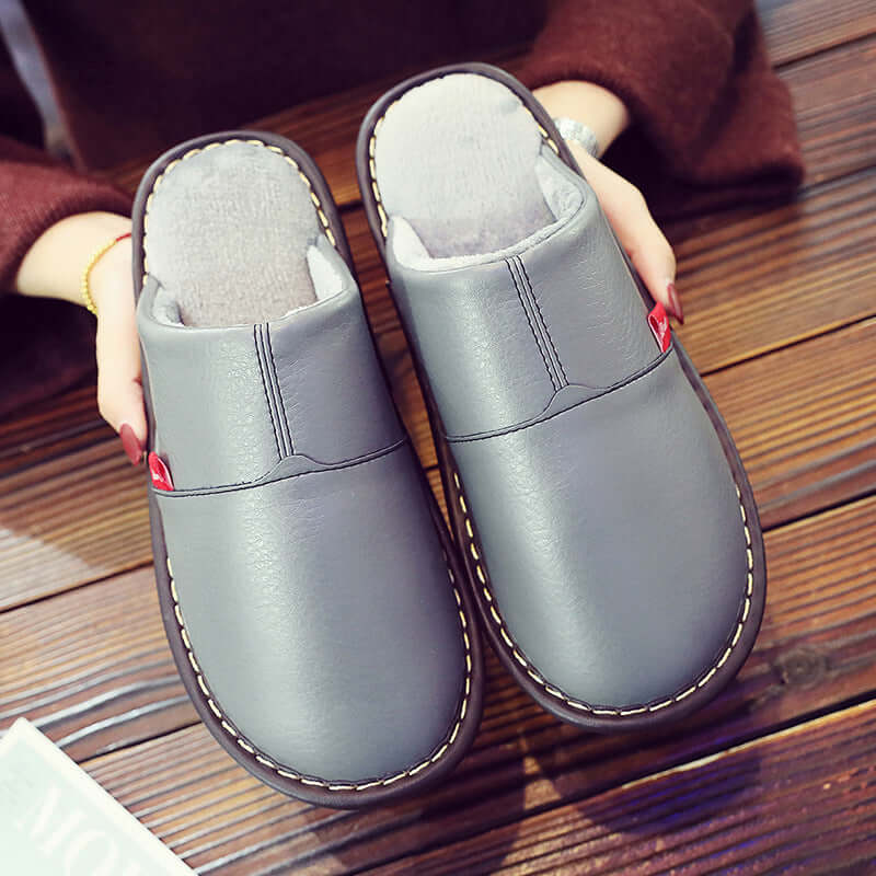 Winter new PU skin water-water cotton slippers couple home home non-slip warm thick shoes female moon shoes wholesale